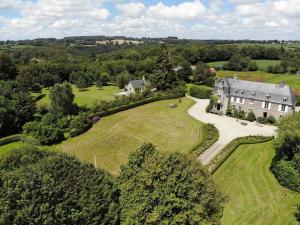 an aerial view of a large house with a garden at Château des Boulais Suite in Saint-Martin-le-Bouillant