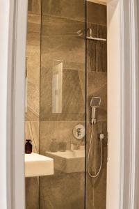 a bathroom with a shower and a sink at ATRIO Apartments 3 in Trenčín