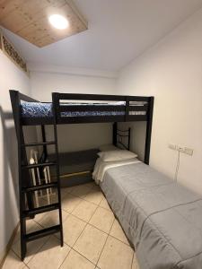a bedroom with a bunk bed and a book shelf at Casa Campomonte in Poppi +18 photos