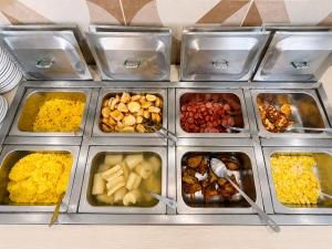 a tray filled with different types of food at Hotel Nacional Arapiraca in Arapiraca