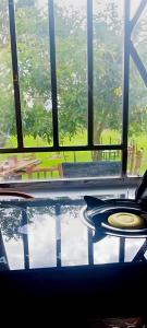 a room with a table and chairs and a pool at MATENI's B&B in Naivasha