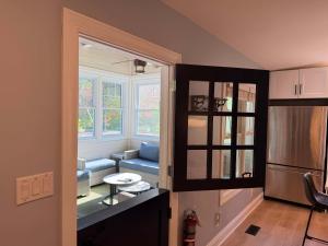 a living room with a couch and a window at Rise n Shine in Saugatuck +11 photos