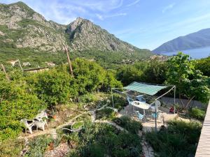 an aerial view of a garden with mountains in the background at Laniakea small apartment in the house in Risan in Risan