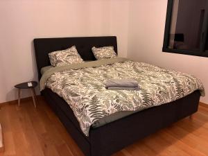 a bed in a bedroom with a blanket and pillows at villa des gorges in Vagnas +28 photos