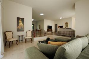 a living room with a couch and chairs at Villa Katrin in Ialysos