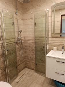 a bathroom with a shower and a sink at Morski Klimat in Jastrzębia Góra +58 photos