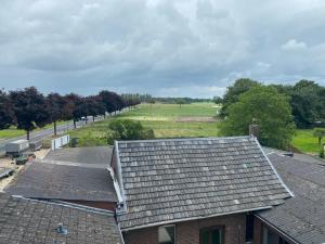 an overhead view of roofs of houses and a road at Stefans Apartments C - 20 min bis DD Messe und Flughafen inkl Parkplatz in Willich