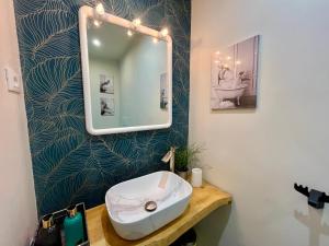 a bathroom with a sink and a mirror at DMC - Alloggio Turistico in Anzio