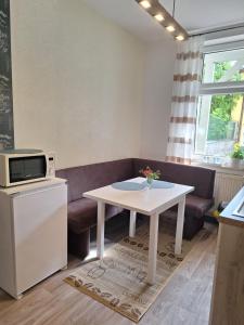 TV in/ali zabaviščno središče v nastanitvi Ferienwohnung Anika Maxima