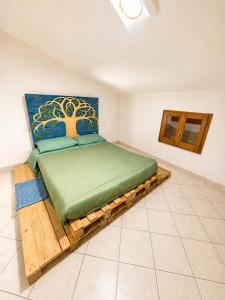 a bedroom with a bed on a wooden platform at Casa Campomonte 2 in Poppi Stazione +18 photos