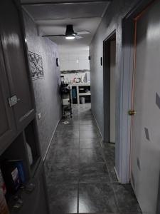 a hallway of a room with a door and a hallwayngth at El Rinconcito in Santa Ana