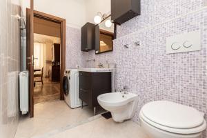 a bathroom with a toilet and a sink at "Cà Niella" in centro e a 9 m dal mare in Savona +29 photos