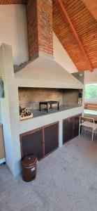 an outdoor kitchen with a stove in a house at Villa Miševići in Hadžići