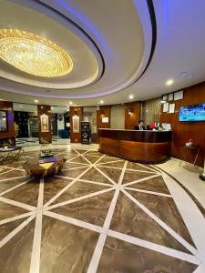 a lobby of a hotel with a reception desk at Hilton Suites Lahore in Lahore +81 photos