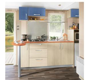 a kitchen with blue cabinets and a sink at Camping La Montagne in Sorgues