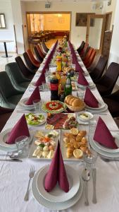 a long table full of food on a long table at Konak Studenica 1186 in Kraljevo +19 photos