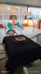 a black table with a plate on top of it at Apartamento Perea playa in Tavernes de Valldigna