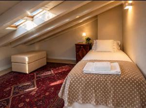 a bedroom with a large bed and a window at Lake View 49 in Sale Marasino