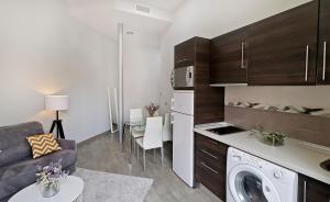 Kuchyňa alebo kuchynka v ubytovaní Apartamentos Calle Larios