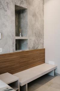 a room with a bench and a mirror at Marinucci Rooms in Termoli +37 photos