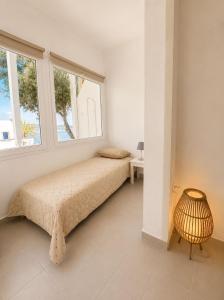 a bedroom with a bed and a window at SPITIA VASILI in Kapsali