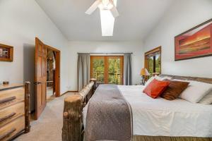 a bedroom with a large bed and a window at Aces and Eights Lodge in Sturgis