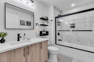 a bathroom with a sink and a toilet and a shower at Professionally managed 1 block to beach Coffee in Seaside Heights +23 photos