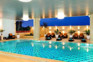 a large swimming pool in a hotel lobby at Four Points by Sheraton Lagos in Lagos