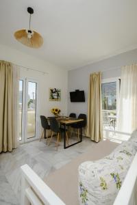 a living room with a table and a couch at Dialinas Apartments in Istro