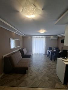 a living room with a couch and a table at Apartman Bogić in Golubac
