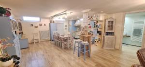 a large room with a kitchen with a table and chairs at Alessandra‘s House in Arezzo +8 photos