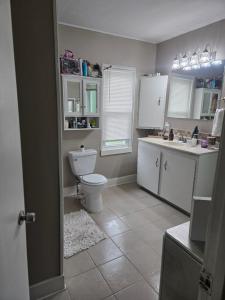 a bathroom with a toilet and a sink at Tranquil Retreat-Off the Beaten Path in Independence +23 photos