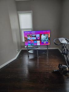 a living room with a flat screen tv on a table at Tranquil Retreat-Off the Beaten Path in Independence
