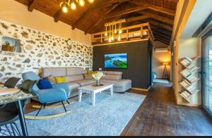 a living room with a couch and a table at The Stonehouse in Ulcinj