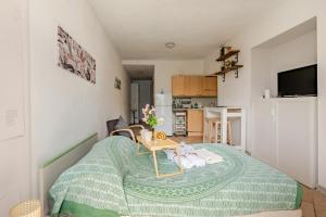 a small room with a bed and a table at Lakeside Paradise Porlezza in Cima