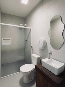 a bathroom with a toilet and a sink and a shower at Shalon Adonai by Martinelli Lodge in Fernando de Noronha +45 photos