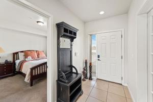 a bedroom with a bed and a wood burning stove at Salmon Run Condo - Overlooking the Spokane River in Post Falls