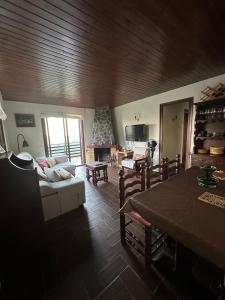 a living room with a couch and a table at Mas Eucaliptus in Susqueda +14 photos