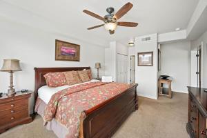 a bedroom with a bed and a ceiling fan at Riverside Condo - Gorgeous Spokane River View in Post Falls