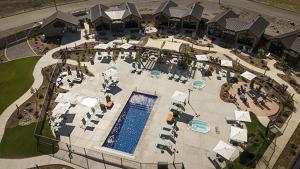 an overhead view of a pool with tables and chairs at Rain Rock Casino Resort Hotel in Yreka
