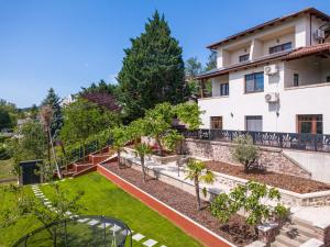 a view of the garden of a house at Olgi Milla Villa in Balatonalmádi