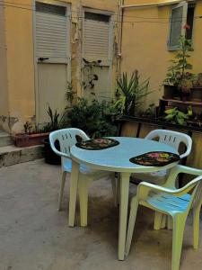 a table and two chairs and a table and chairs at One bedroom apartment in Marsaskala