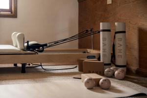 a room with a bed and a lamp and balls on the floor at Harvest Cottage Blue Mountains in Leura