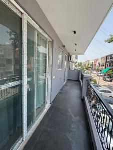 a balcony of a house with a large window at Third Pole in Kathmandu