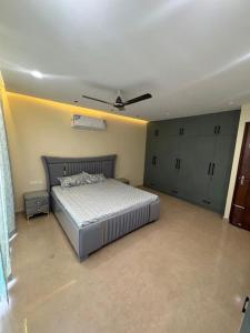 a bedroom with a bed and a ceiling fan at Third Pole in Kathmandu +1 photo