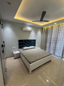 a bedroom with a bed and a ceiling at Third Pole in Kathmandu
