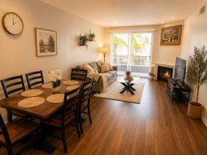 a living room with a table and a couch at Ocean Breeze Stay Near Airport LAX & Stadium in Los Angeles