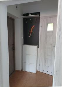 a room with a white cabinet and a door at Dana in Sokołowsko
