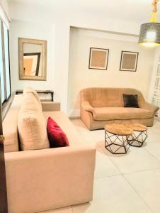 a living room with a couch and a table at Los BOLICHES Playa in Fuengirola