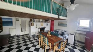 a dining room with a table and a staircase at Ampia casa marinara con meravigliosa terrazza vista mare Da Mario e Rosanna in Portovenere +27 photos